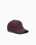 Baseball hat with an embossed logo pattern and a patch