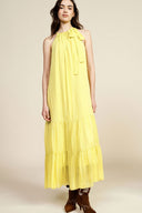 Long sleeveless dress with ruffles and halter neck
