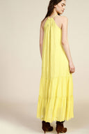 Long sleeveless dress with ruffles and halter neck