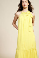 Long sleeveless dress with ruffles and halter neck