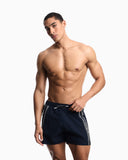 Swim shorts with logo tape