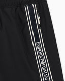 Swim shorts with logo tape