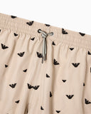 Swim shorts with all-over micro eagle embroidery