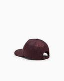Baseball hat with an embossed logo pattern and a patch