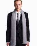 Virgin wool scarf with a woven logo and fringed edges