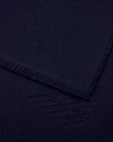 Virgin wool scarf with a woven logo and fringed edges