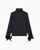 Blouse in recycled crepe with high neckline and tie cuffs