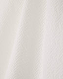 Short-sleeve shirt with double collar and chevron pattern