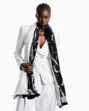 Jacquard logo stole in wool and cashmere with fringed edges