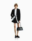 Handbag in smooth leather with top handles and a zip closure