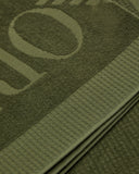 Waffle-weave beach towel with jacquard logo