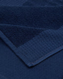 Waffle-weave beach towel with jacquard logo