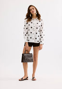 White shirt with black polka dots