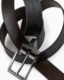 Reversible leather belt with all-over embossed lettering