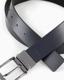Reversible leather belt with all-over embossed lettering